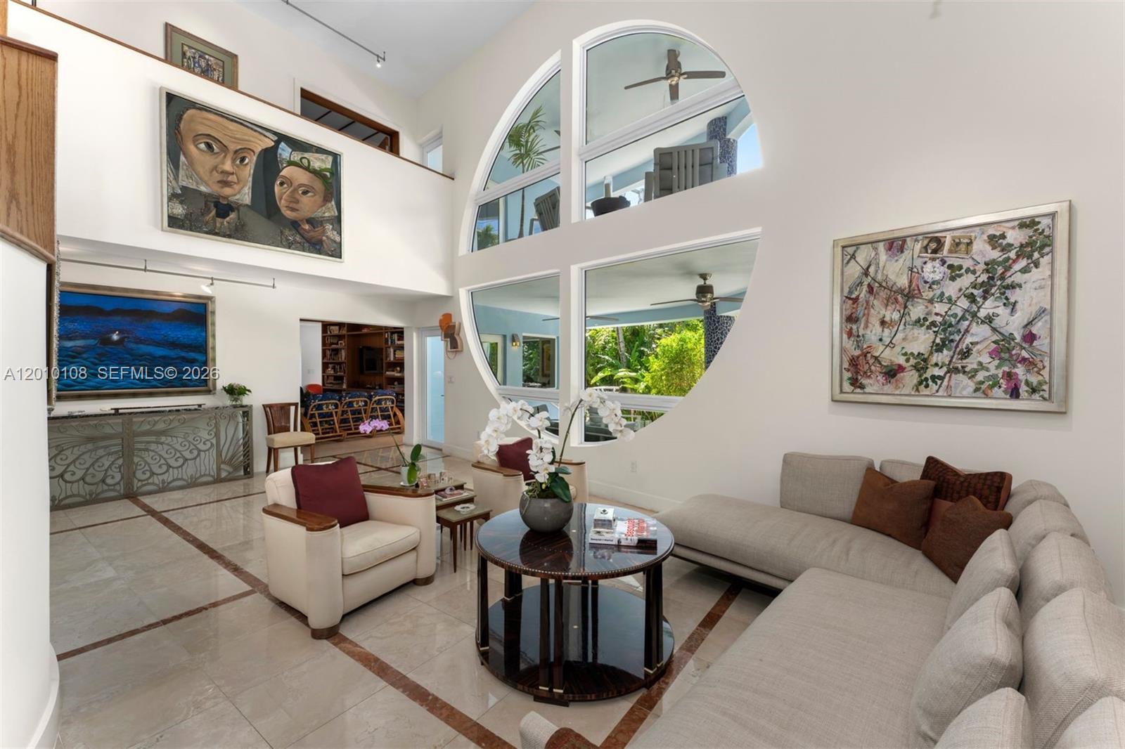 690 Warren Lane Key Biscayne, FL 33149 - Photo 7 of 39 a living room with furniture and a potted plant