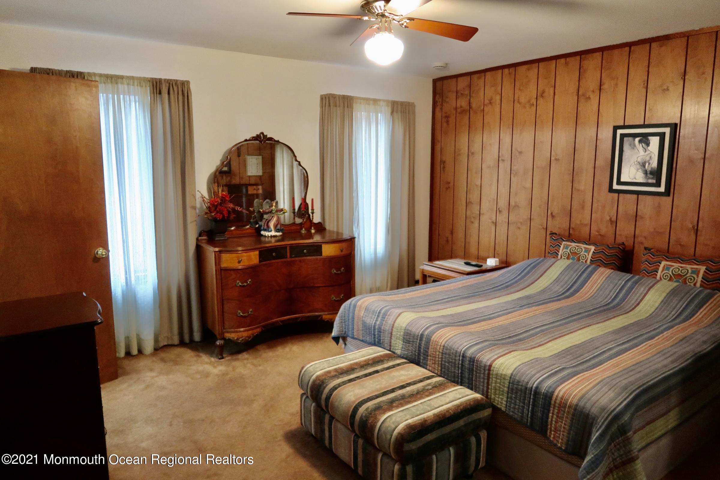 11 Frank Applegate Road Jackson, NJ 08527 - Photo 14 of 37 a bedroom with a bed and a chandelier