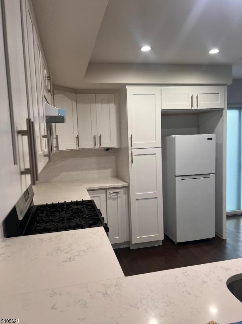 111 Pennington Street Newark, NJ 07105 - Photo 12 of 13 a kitchen with a refrigerator and a stove