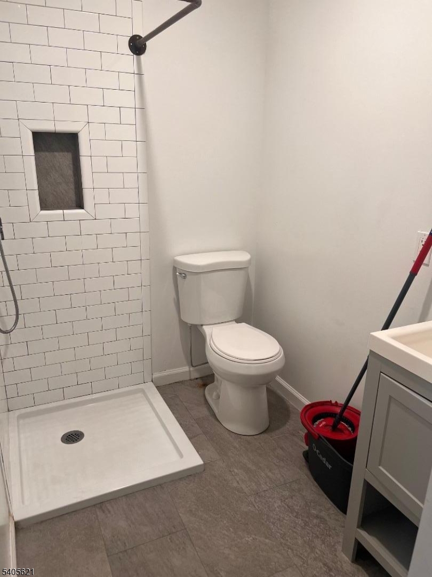 111 Pennington Street Newark, NJ 07105 - Photo 8 of 13 a bathroom with a toilet and a shower