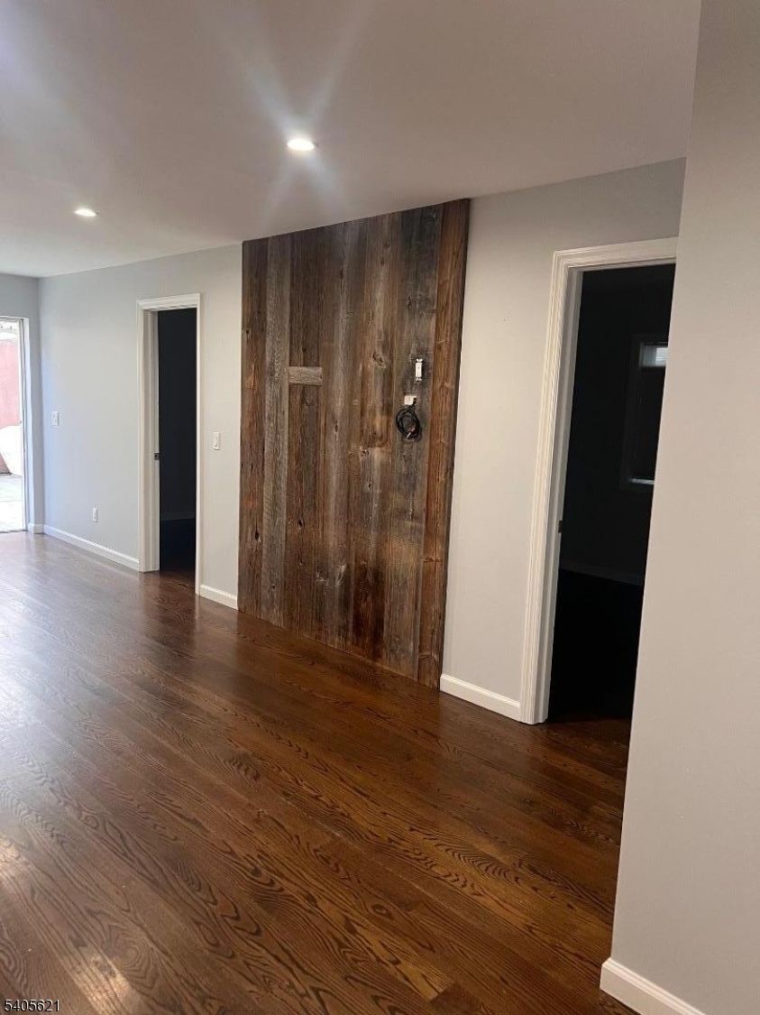 111 Pennington Street Newark, NJ 07105 - Photo 10 of 13 an empty room with wooden floor and closet