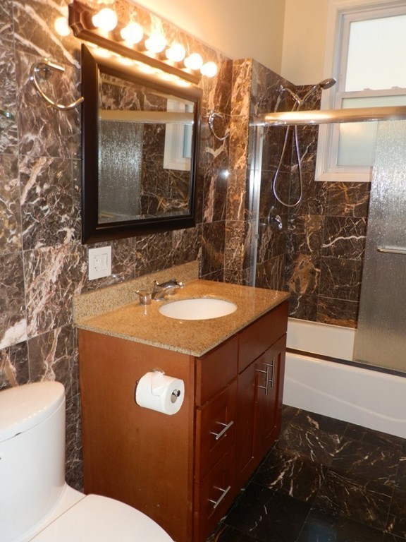 194 Auburn Street, Unit 1 Newton, MA 02466 - Photo 7 of 15 a bathroom with a sink toilet and shower