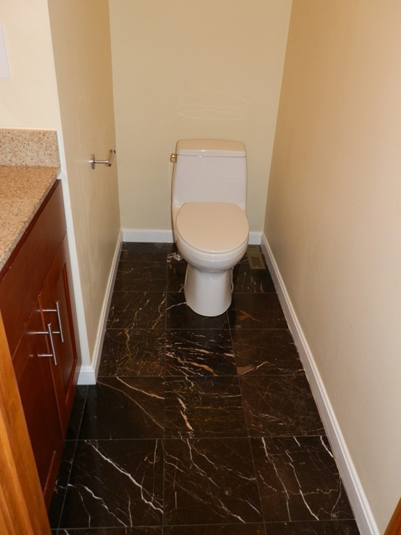 194 Auburn Street, Unit 1 Newton, MA 02466 - Photo 9 of 15 a bathroom with a toilet and a sink