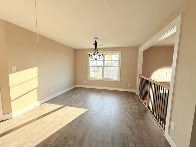 a bathroom with a tub shower and a sink