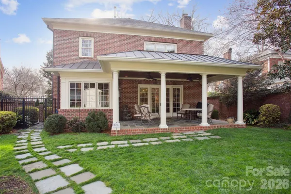 a view of a house with a yard and plants