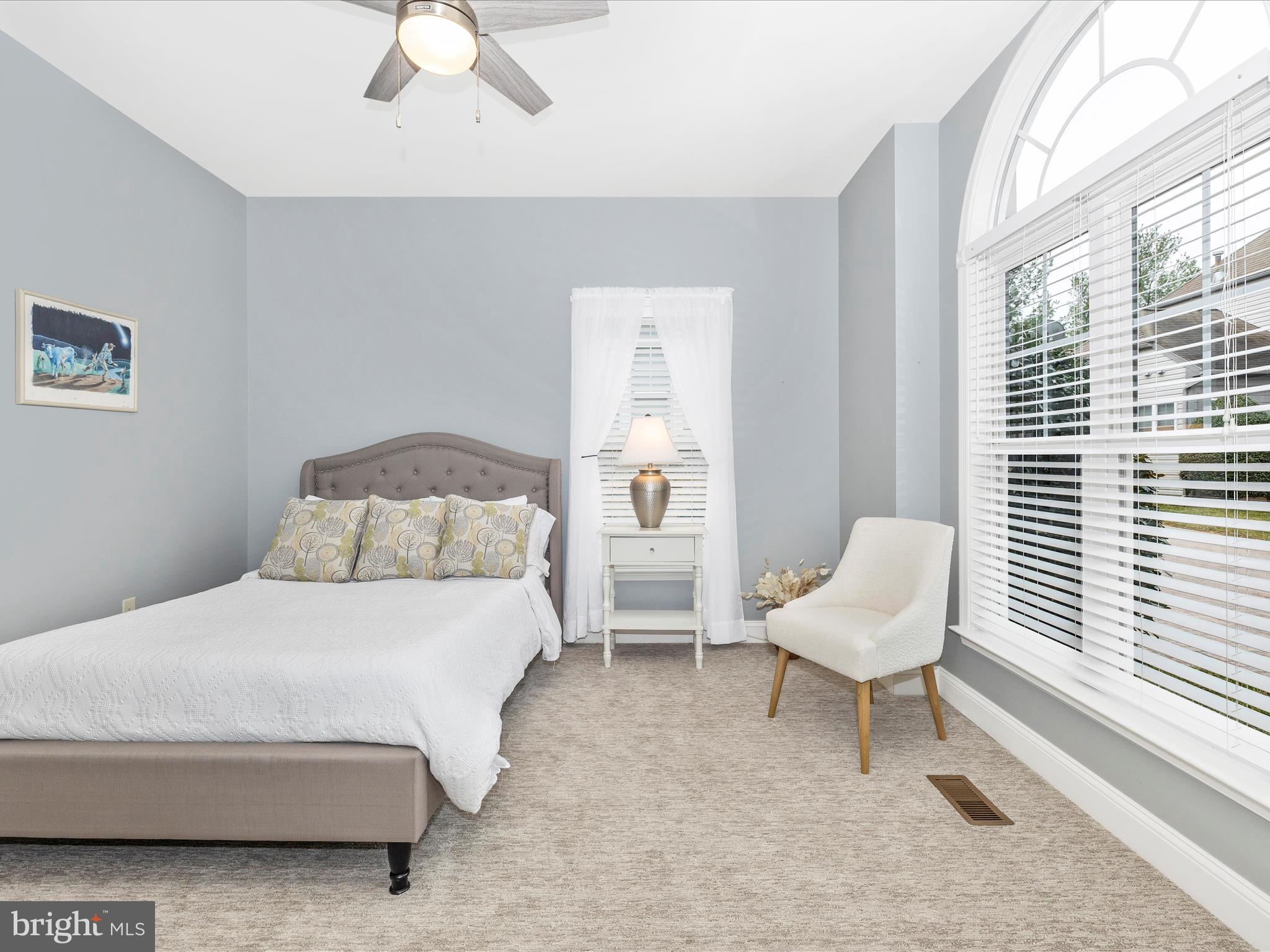 2661 Monocacy Ford Road Frederick, MD 21701 - Photo 32 of 52 a bedroom with a bed a chair and a large window