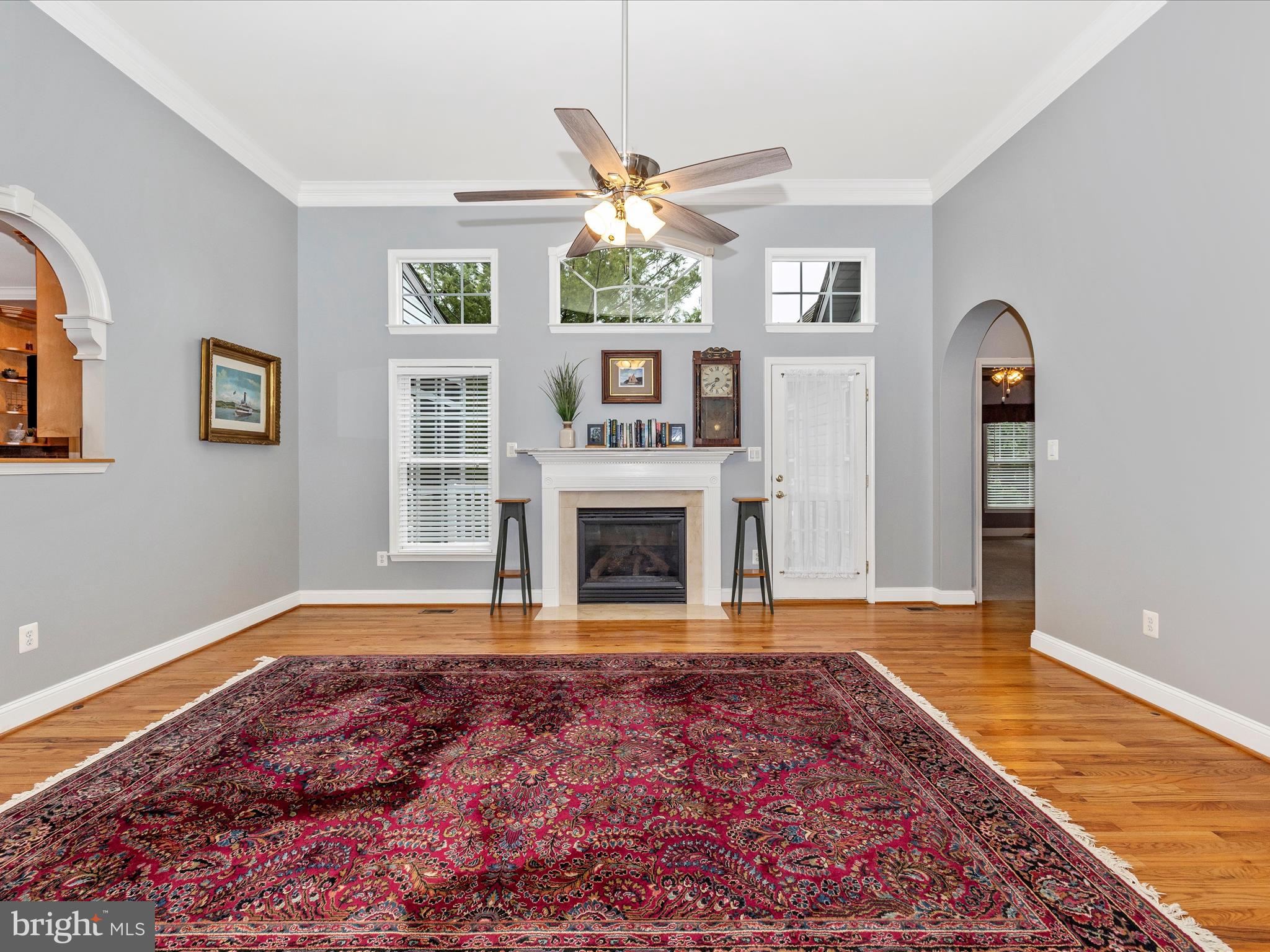 2661 Monocacy Ford Road Frederick, MD 21701 - Photo 9 of 52 a living room with a fireplace windows and a wooden floor