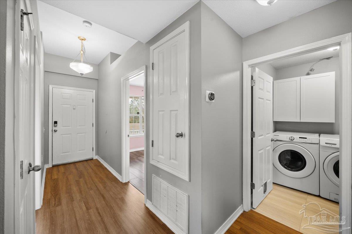1186 Brownfield Road Pensacola, FL 32526 - Photo 3 of 20 a view of a hallway with washer and dryer