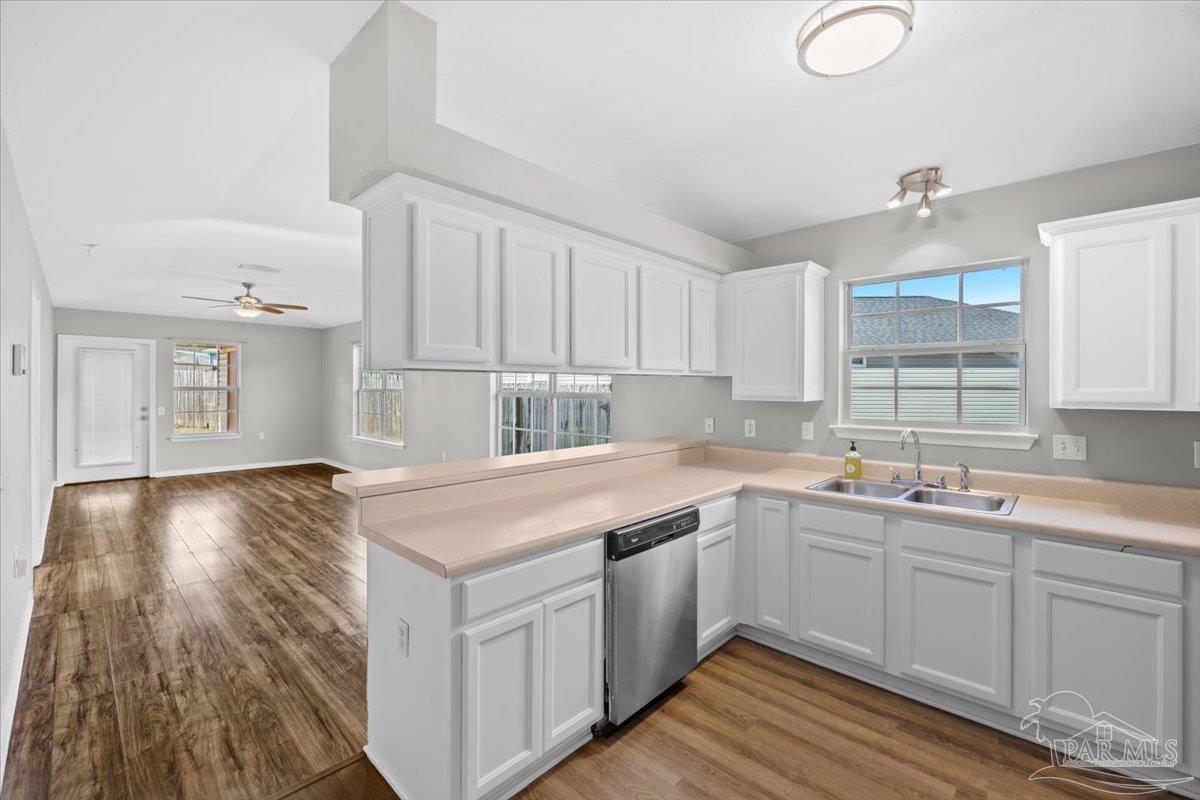 1186 Brownfield Road Pensacola, FL 32526 - Photo 7 of 20 a kitchen with a sink stove and cabinets