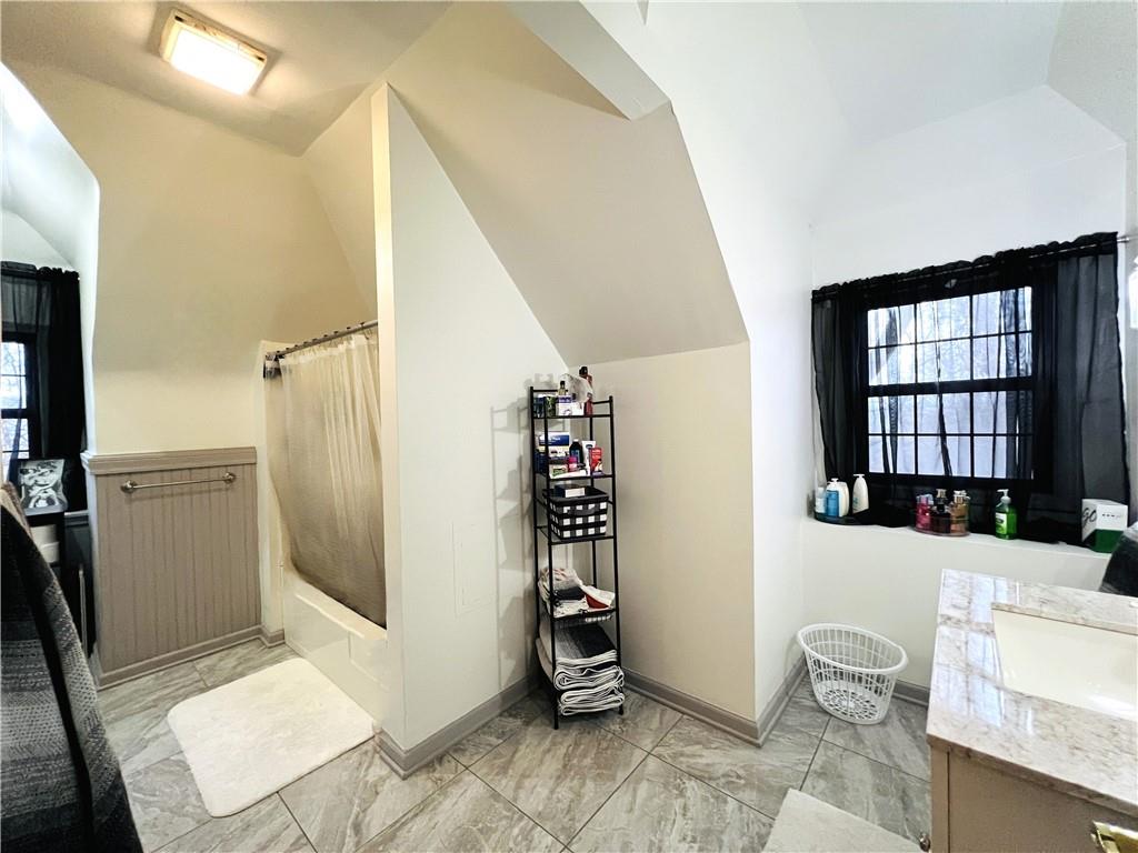 304 Rhodes Place New Castle, PA 16101 - Photo 13 of 31 a bathroom with a sink toilet and shower