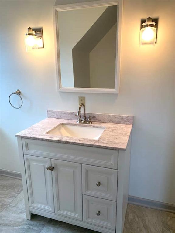 304 Rhodes Place New Castle, PA 16101 - Photo 14 of 31 a bathroom with a sink and a mirror