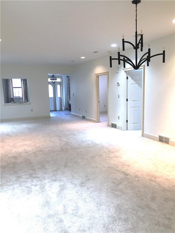 304 Rhodes Place New Castle, PA 16101 - Photo 16 of 31 a view of a livingroom with a ceiling fan and window