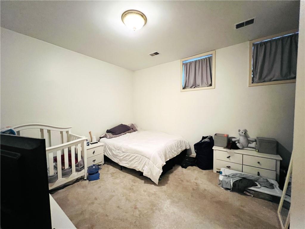 304 Rhodes Place New Castle, PA 16101 - Photo 22 of 31 a bedroom with a bed and cabinets