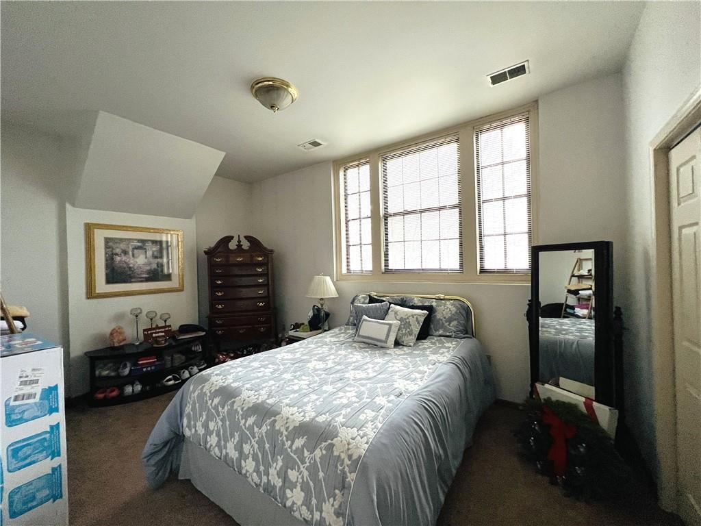 304 Rhodes Place New Castle, PA 16101 - Photo 29 of 31 a bedroom with a bed and a closet