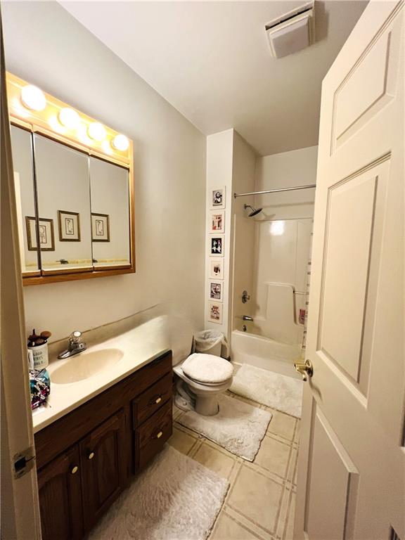 304 Rhodes Place New Castle, PA 16101 - Photo 30 of 31 a bathroom with a double vanity sink toilet mirror and a shower