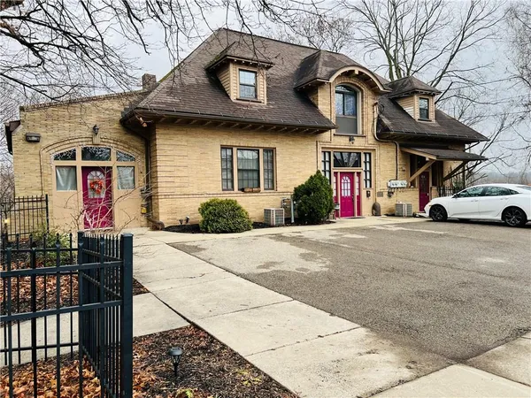 a front view of a house with garage