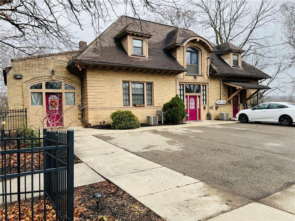 304 Rhodes Place New Castle, PA 16101 - Photo 3 of 31 a front view of a house with garage