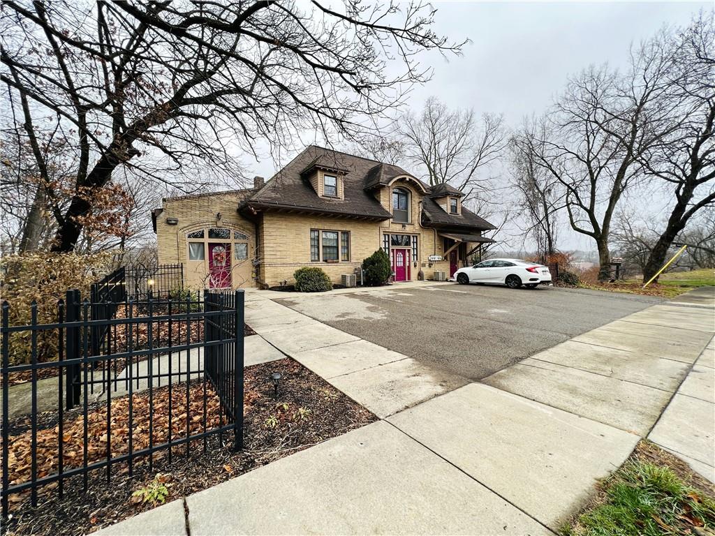 304 Rhodes Place New Castle, PA 16101 - Photo 31 of 31 a view of a white house with a large tree
