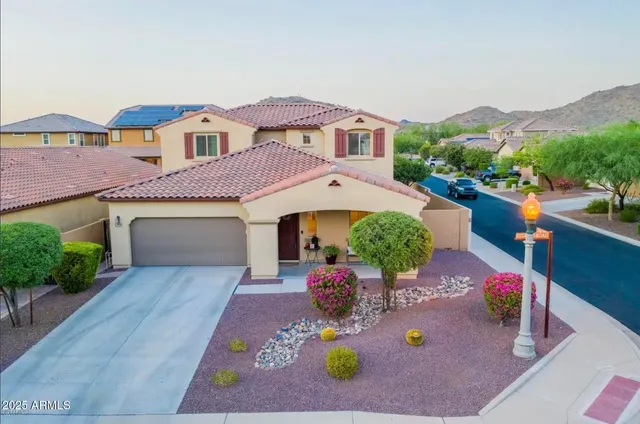 an aerial view of a house with yard