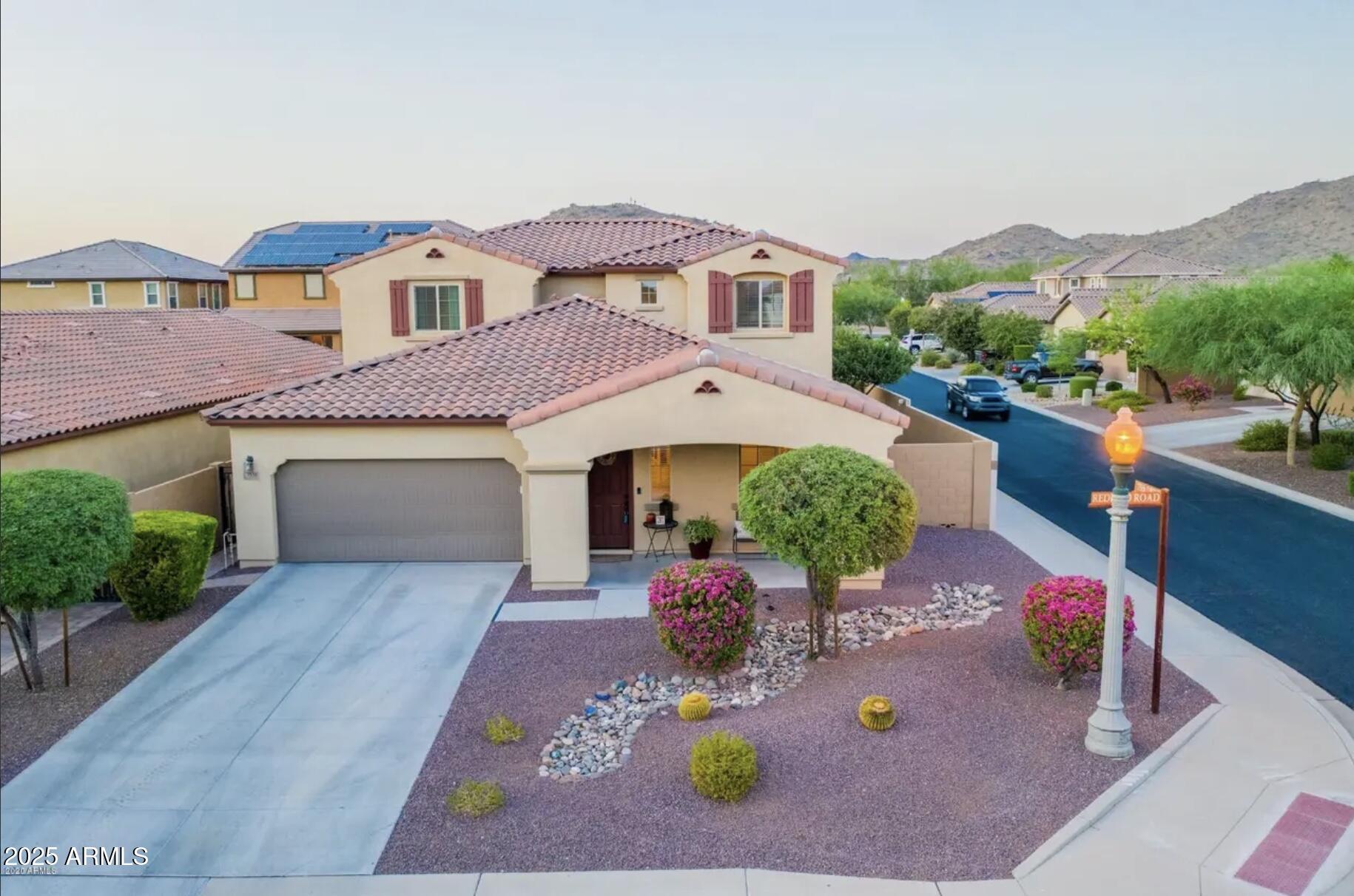 an aerial view of a house with yard