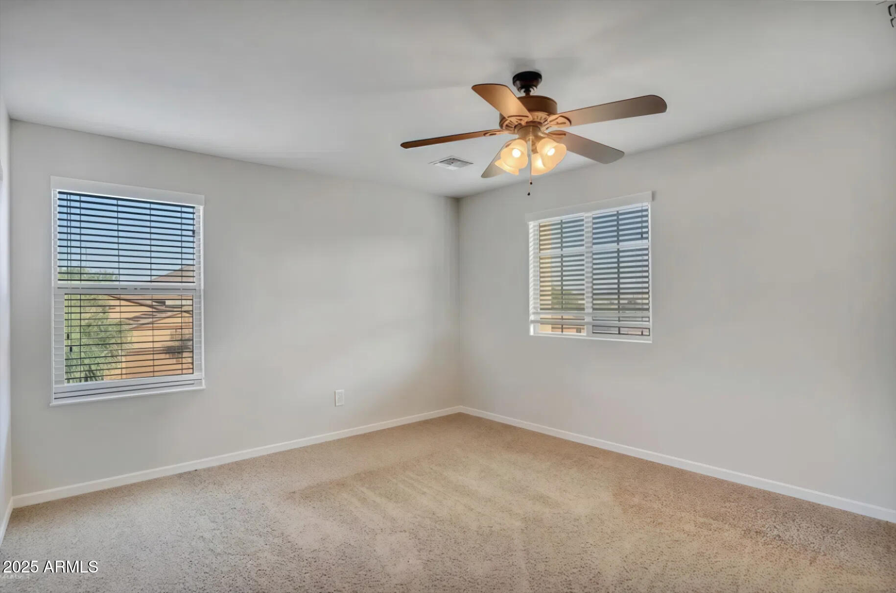 7538 West Redbird Road Peoria, AZ 85383 - Photo 13 of 24 a view of an empty room with a window