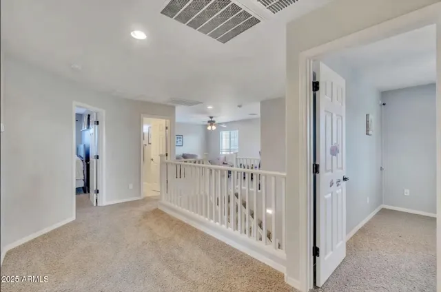 a view of a hallway with windows