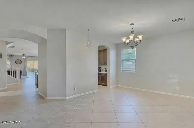 wooden floor in an empty room with a mirror