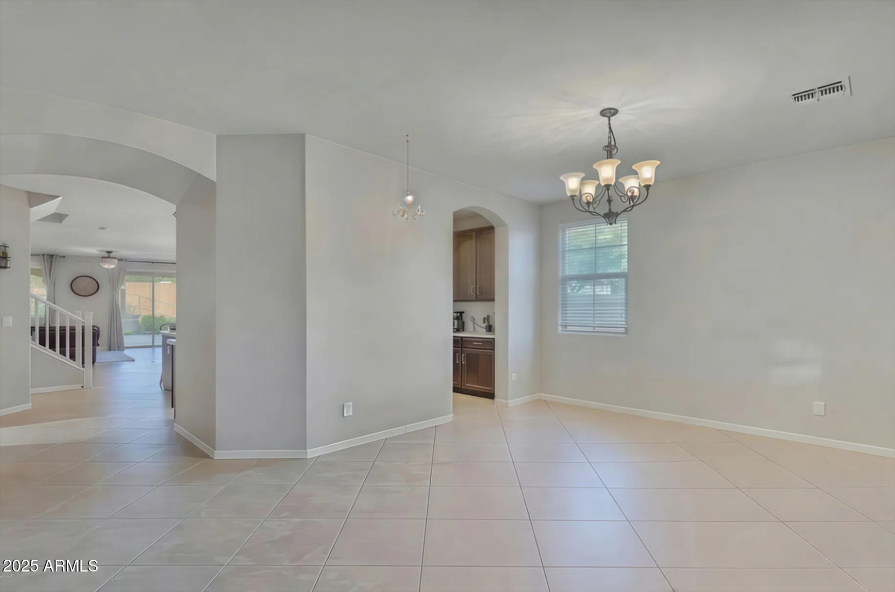 7538 West Redbird Road Peoria, AZ 85383 - Photo 3 of 24 wooden floor in an empty room with a mirror