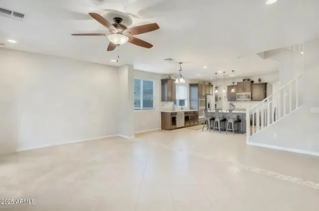 a view of a livingroom with a kitchen