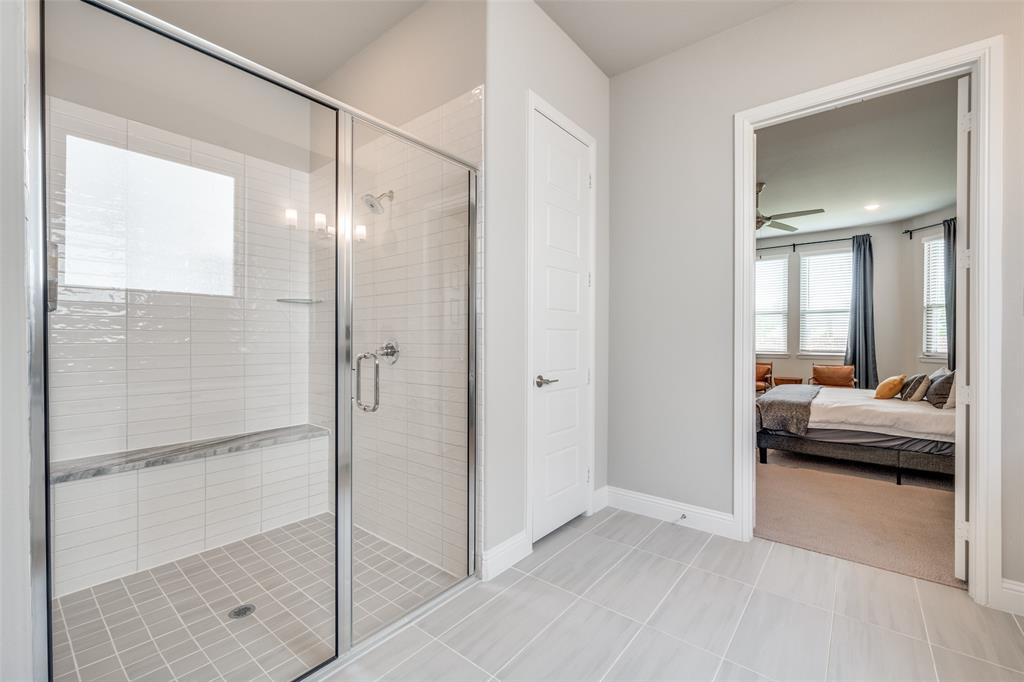 16564 Creek Plum Road Frisco, TX 75033 - Photo 13 of 30 Ensuite bathroom with a stall shower, ceiling fan, and light tile patterned floors