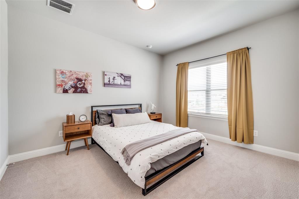16564 Creek Plum Road Frisco, TX 75033 - Photo 19 of 30 Carpeted bedroom with baseboards