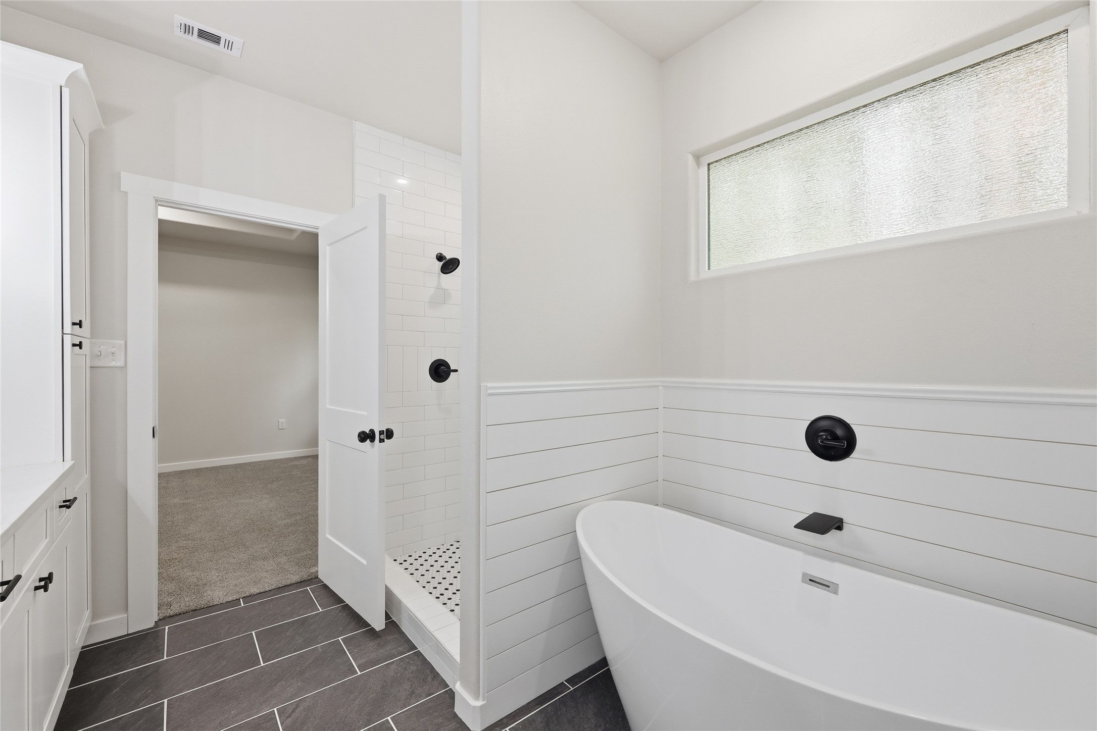 235 Dogwood Road Brookeland, TX 75931 - Photo 15 of 35 a bathroom with a bathtub and shower