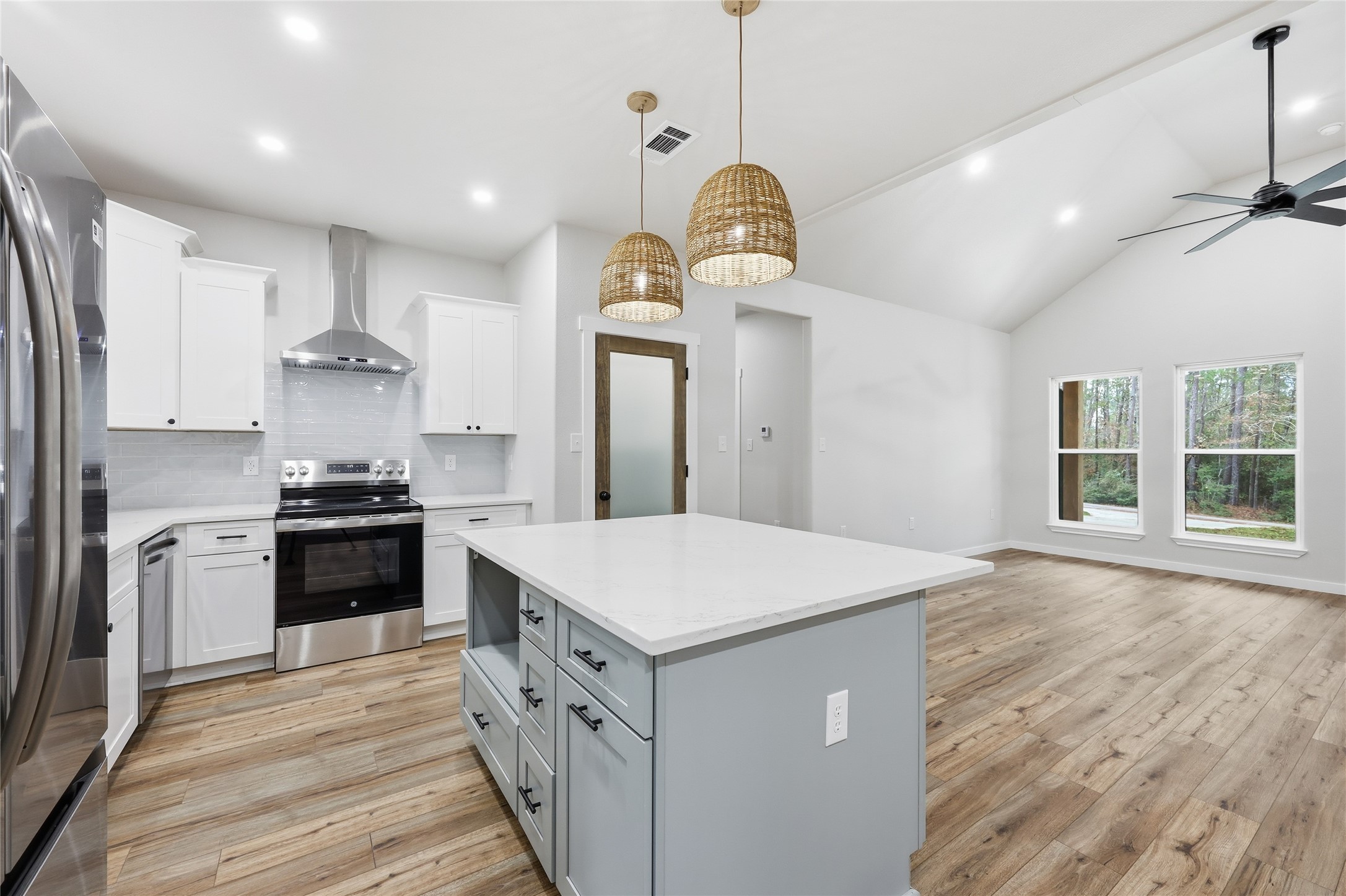 235 Dogwood Road Brookeland, TX 75931 - Photo 19 of 35 a kitchen with a stove cabinets and wooden floor