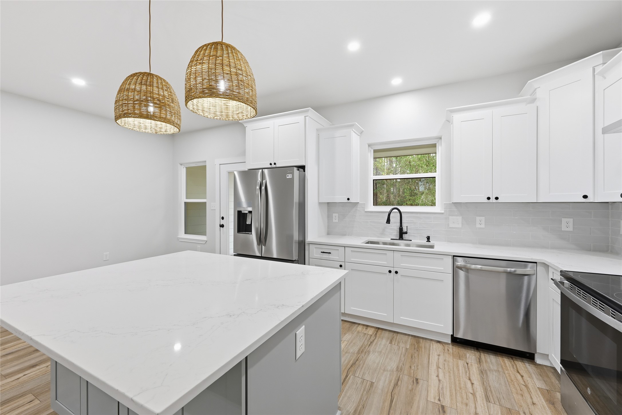 235 Dogwood Road Brookeland, TX 75931 - Photo 20 of 35 a kitchen with cabinets and stainless steel appliances
