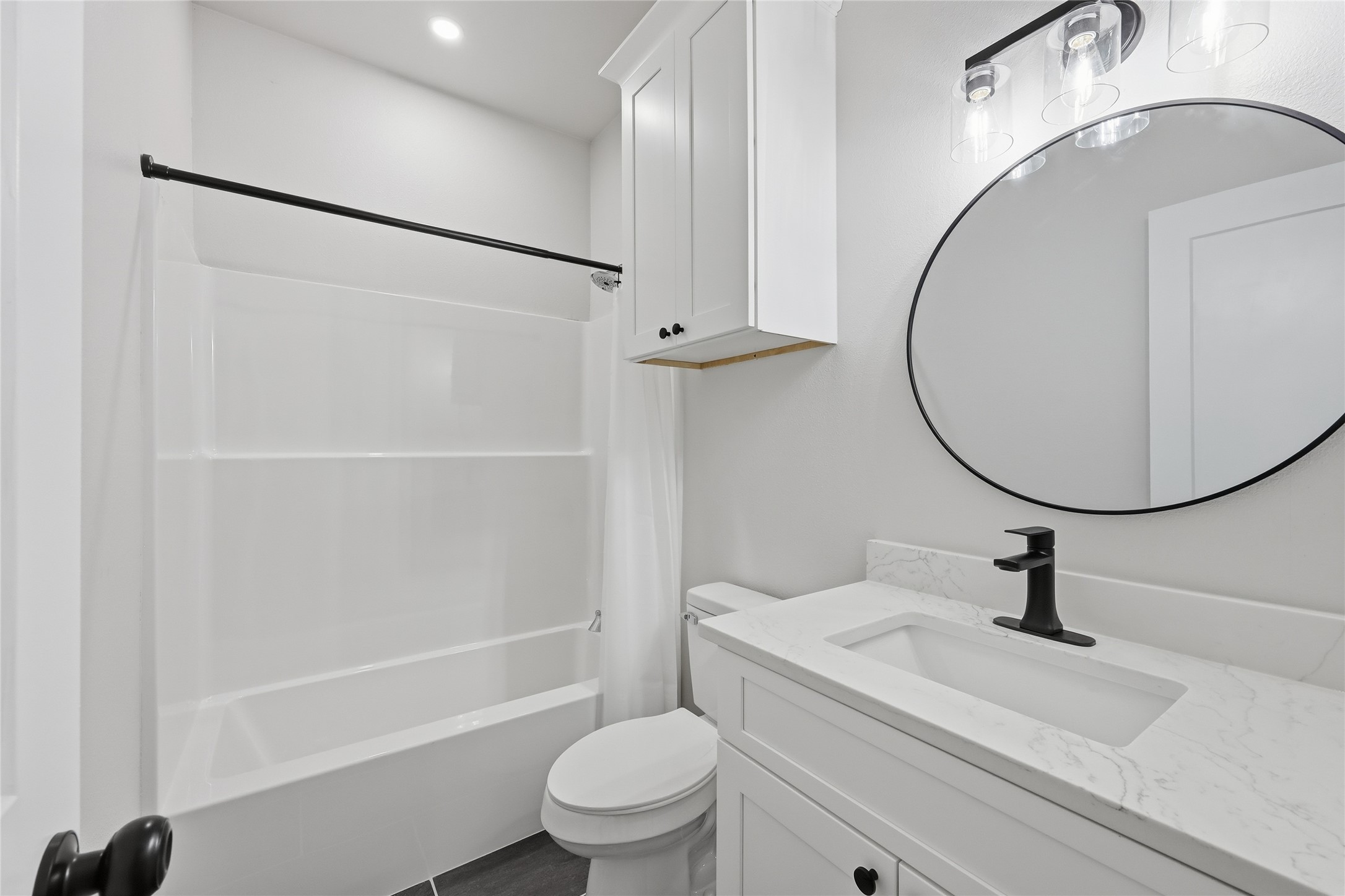 235 Dogwood Road Brookeland, TX 75931 - Photo 24 of 35 a bathroom with a sink a toilet and a mirror