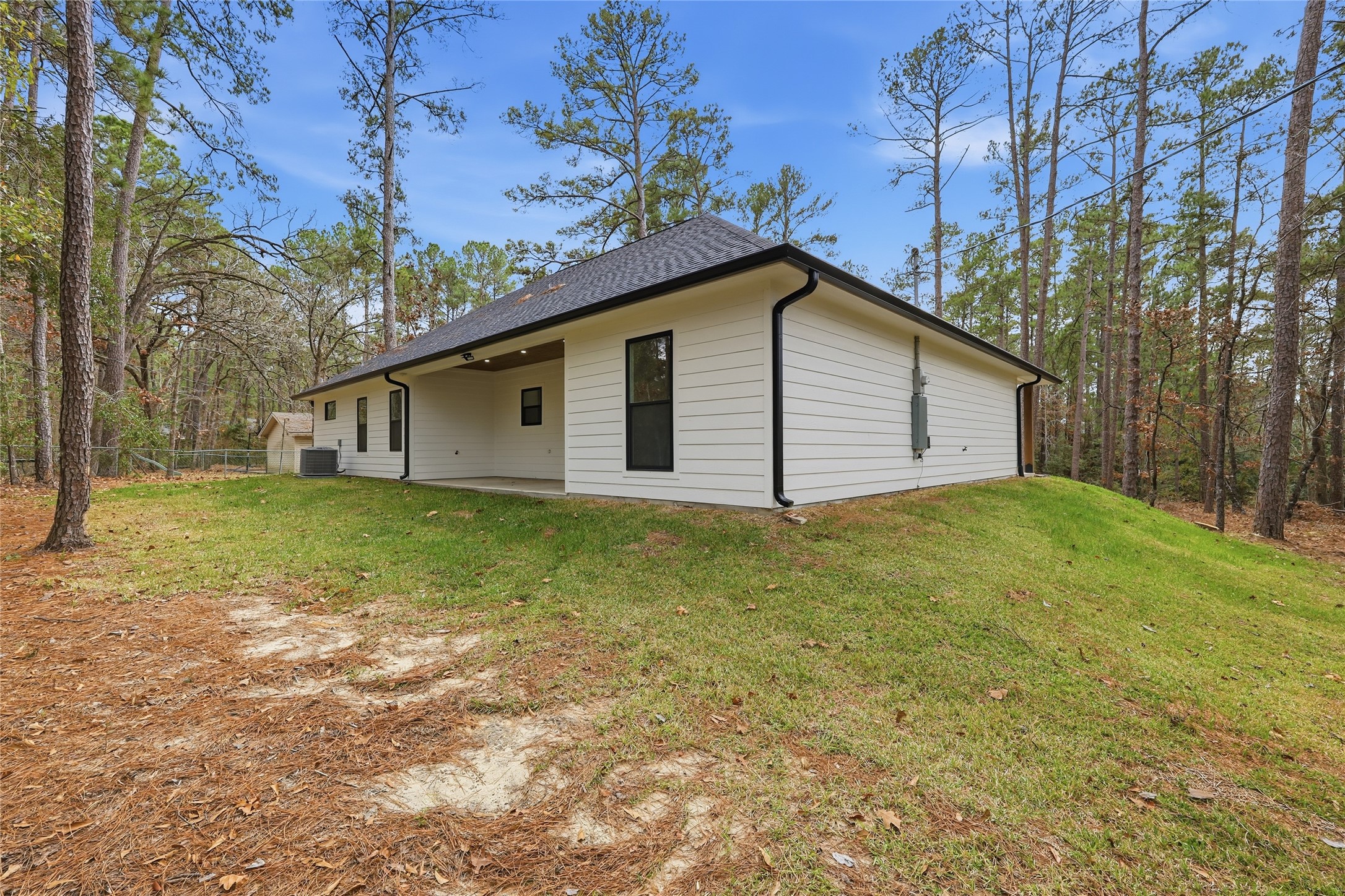 235 Dogwood Road Brookeland, TX 75931 - Photo 29 of 35 a house with a yard