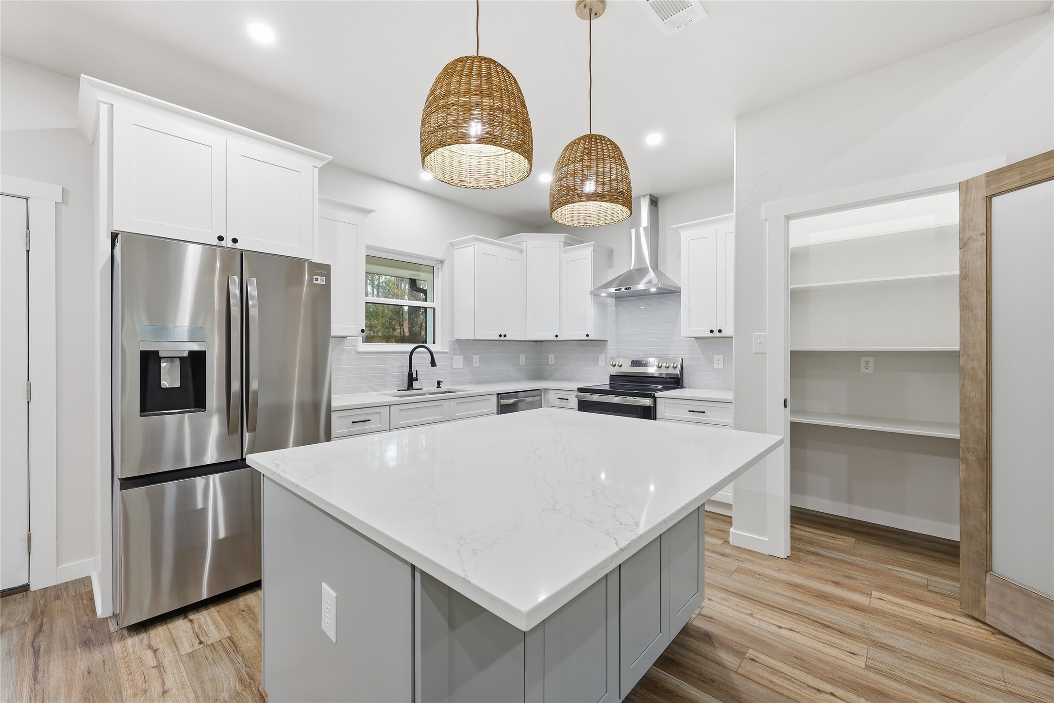235 Dogwood Road Brookeland, TX 75931 - Photo 9 of 35 a kitchen with a refrigerator a sink and a stove