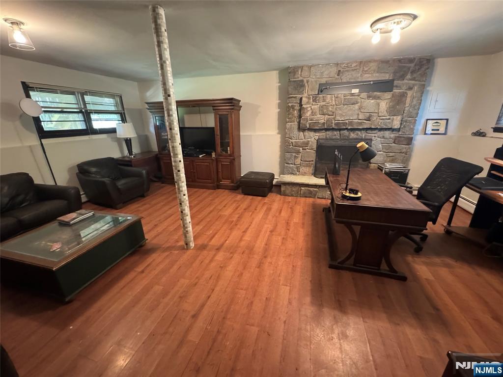 55 Maryann Road Oak Ridge, NJ 07438 - Photo 16 of 20 a living room with furniture and a wooden floor
