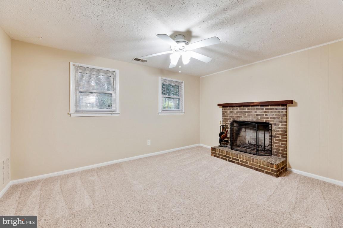 9944 Murnane Street Vienna, VA 22181 - Photo 30 of 42 Lower level finished recreation room with FP