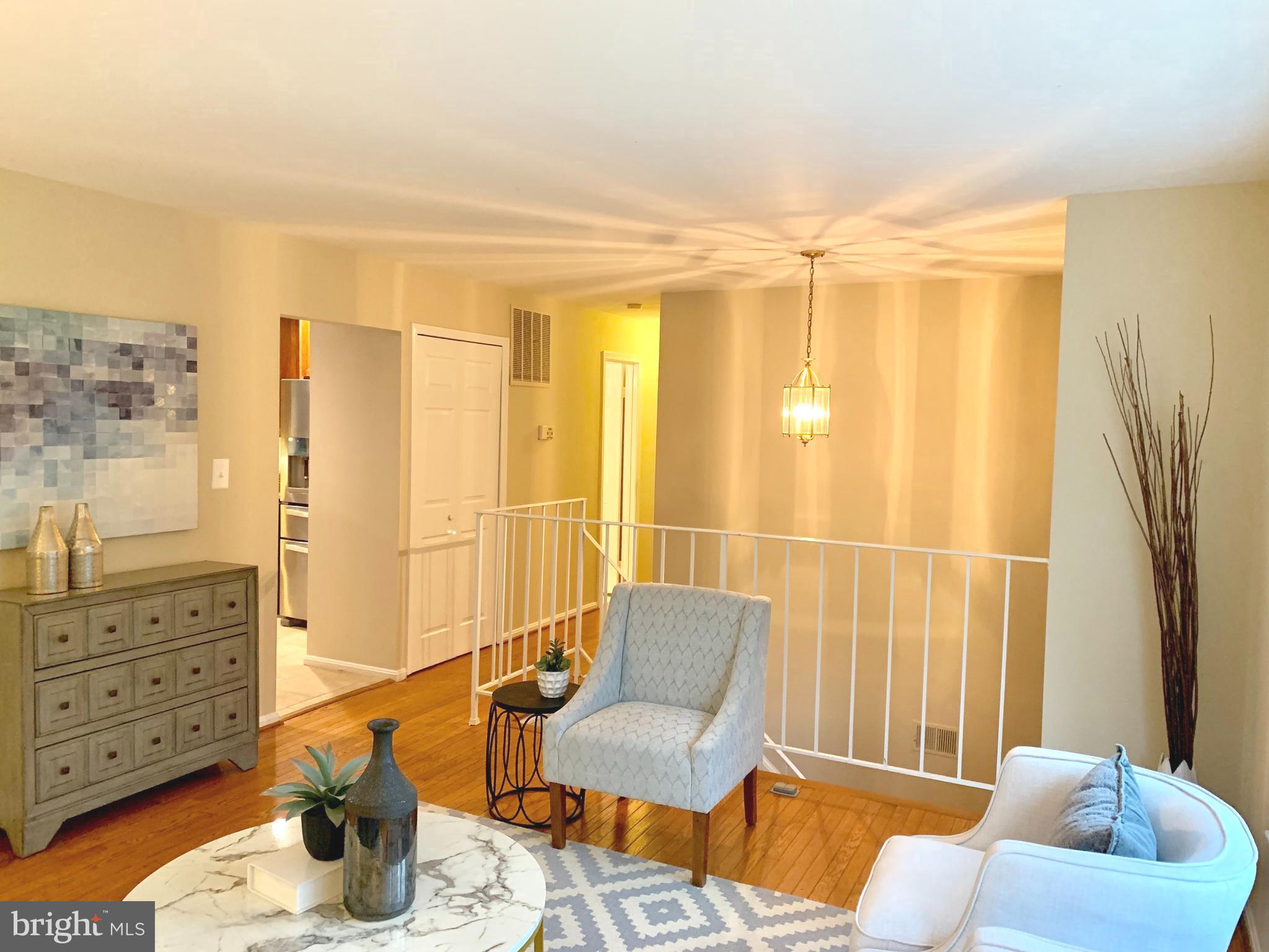 9944 Murnane Street Vienna, VA 22181 - Photo 6 of 42 Hardwood floors in living room and hall