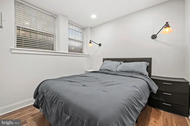 a bedroom with a bed and window