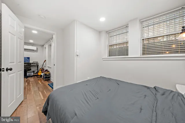 a bed room with a bed and a window