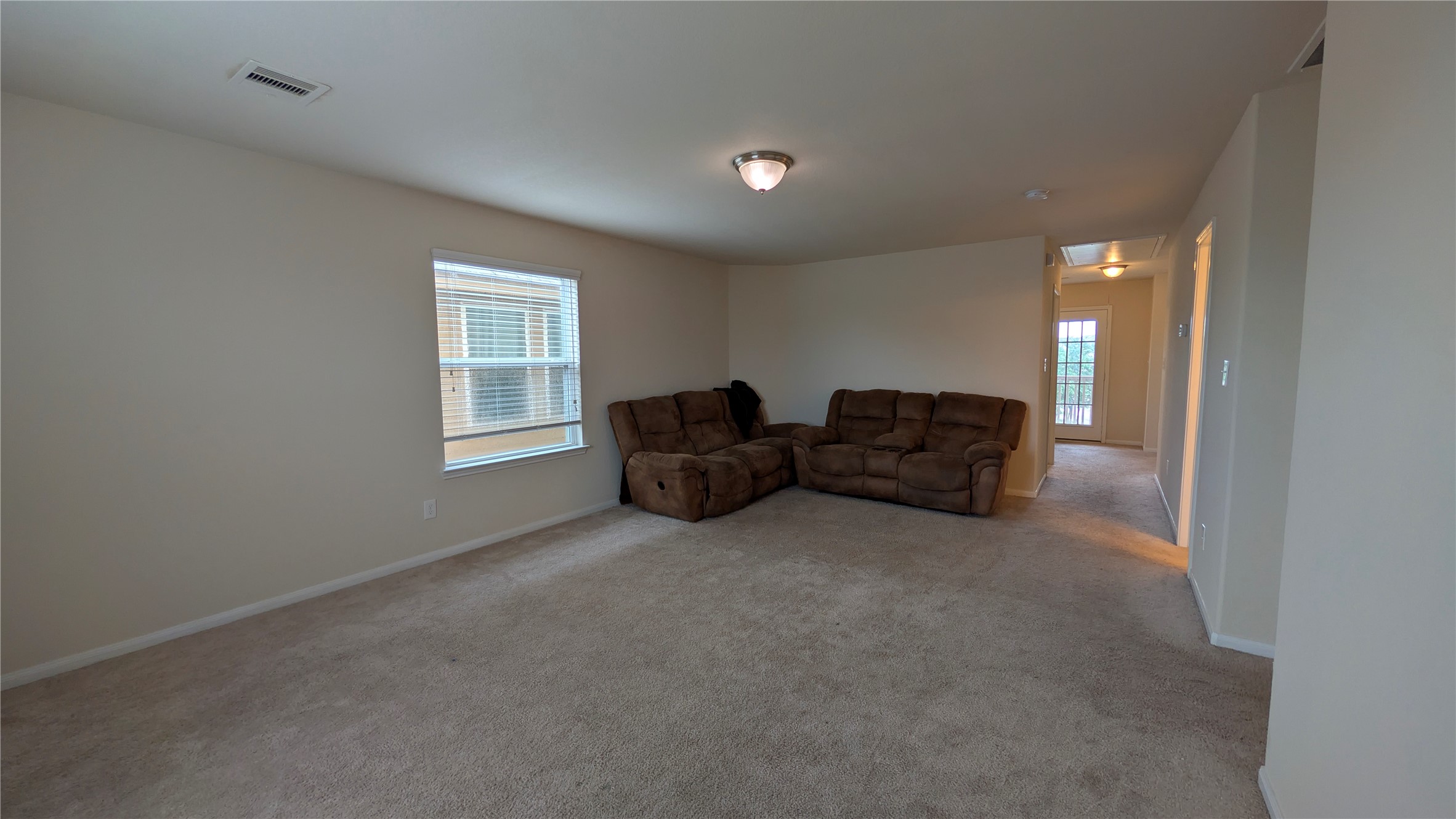 7326 Granite Terrace Lane Houston, TX 77083 - Photo 11 of 39 a living room with furniture and a window