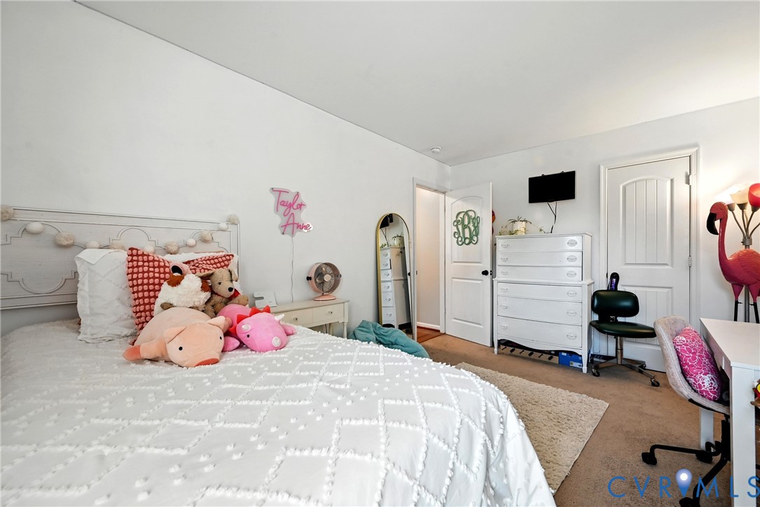 14006 Hackberry Road Chester, VA 23836 - Photo 19 of 41 a bedroom with a bed and closet