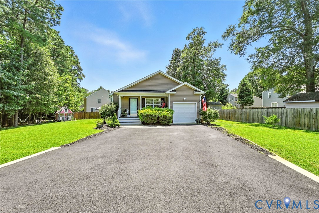 14006 Hackberry Road Chester, VA 23836 - Photo 3 of 41 a front view of a house with a yard