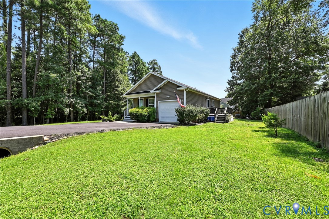 14006 Hackberry Road Chester, VA 23836 - Photo 5 of 41 a front view of house with yard and green space