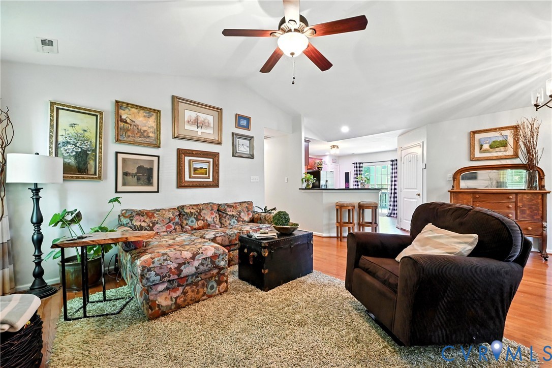14006 Hackberry Road Chester, VA 23836 - Photo 8 of 41 a living room with furniture and painting on the wall