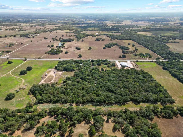 an aerial view of beach and building