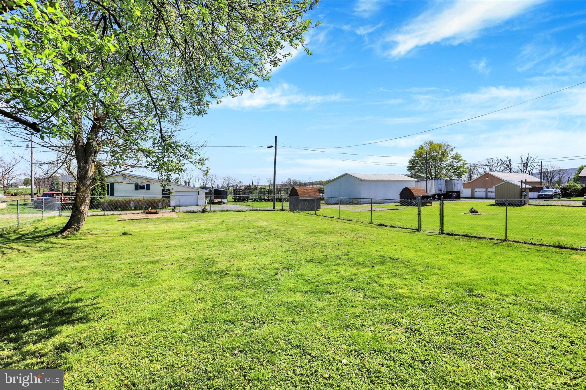1435 Orchard Road Mifflinburg, PA 17844 - Photo 5 of 16 a view of a house with a big yard and large trees