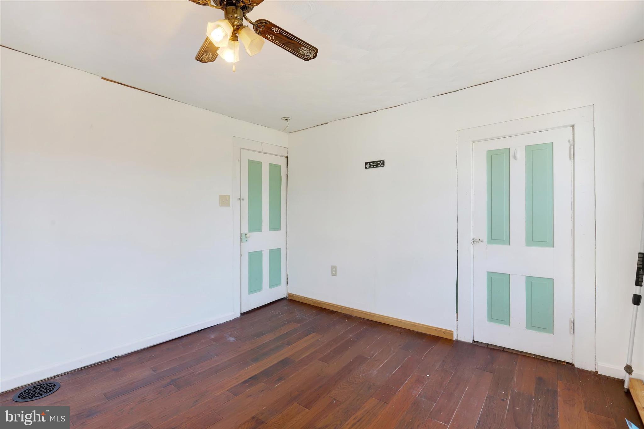1435 Orchard Road Mifflinburg, PA 17844 - Photo 7 of 16 a view of an empty room with wooden floor and a window